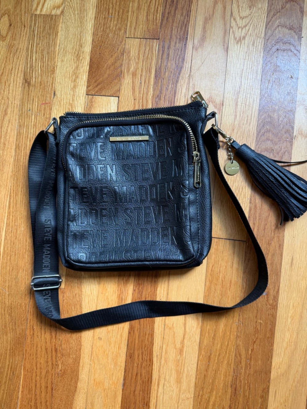 Steve Madden Black Embossed Logo Crossbody Bag with Tassel